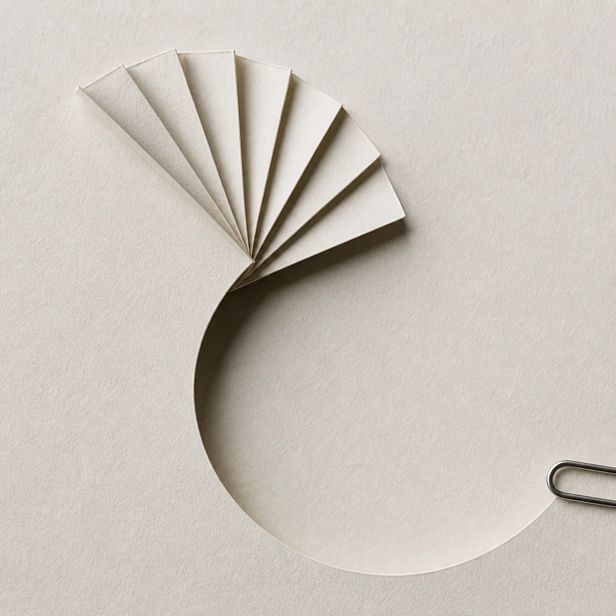 A spiral paper fold returning toward itself, representing feedback shaping the next cycle.